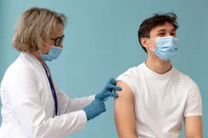 Doctor administering shingles vaccine to prevent herpes zoster infection